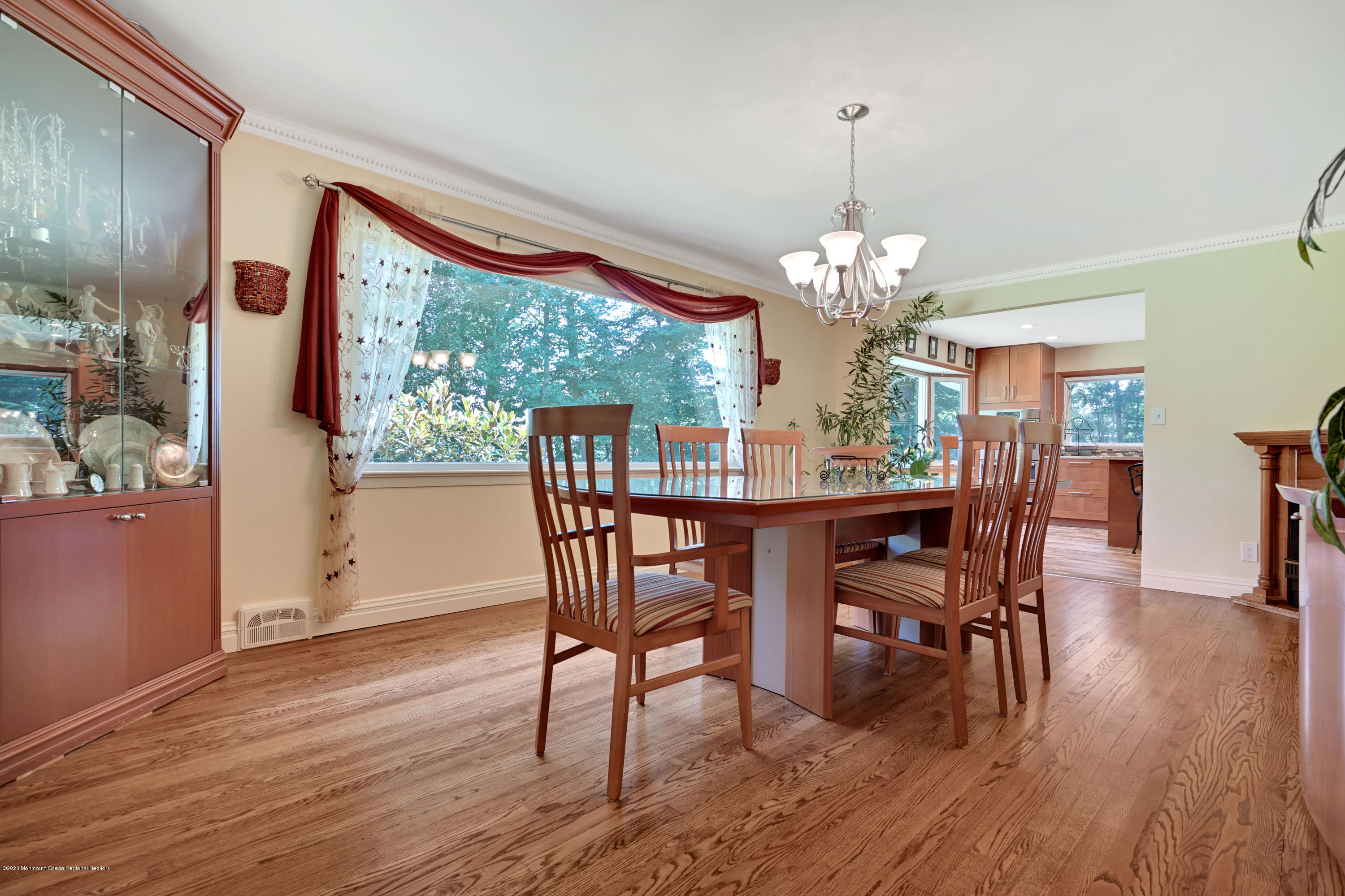 12 Crest Drive Colts Neck, NJ 07722 - Photo 33 of 69 a dining room with furniture a large window and wooden floor
