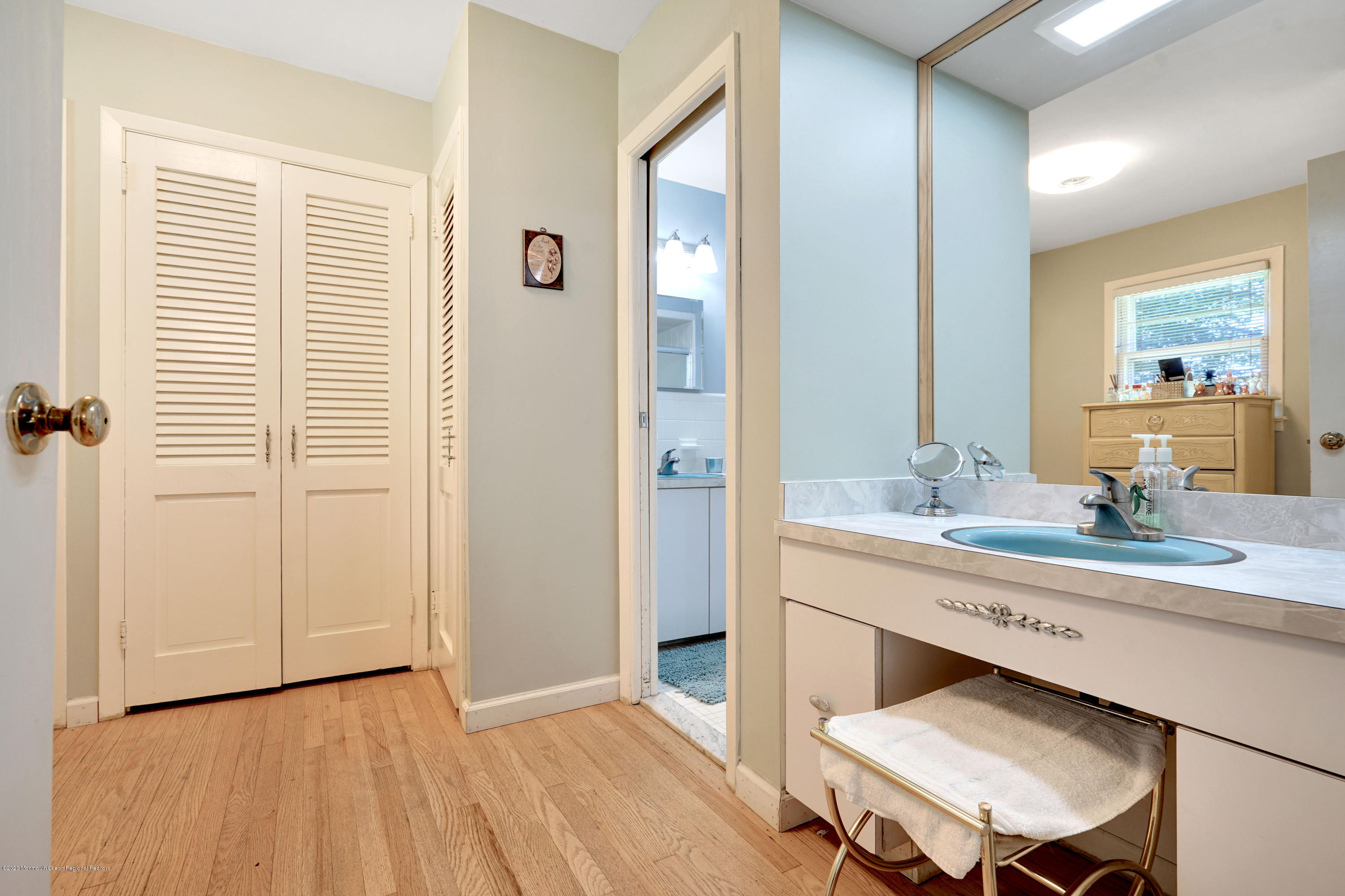 12 Crest Drive Colts Neck, NJ 07722 - Photo 35 of 69 a spacious bathroom with a granite countertop sink a toilet a mirror and shower