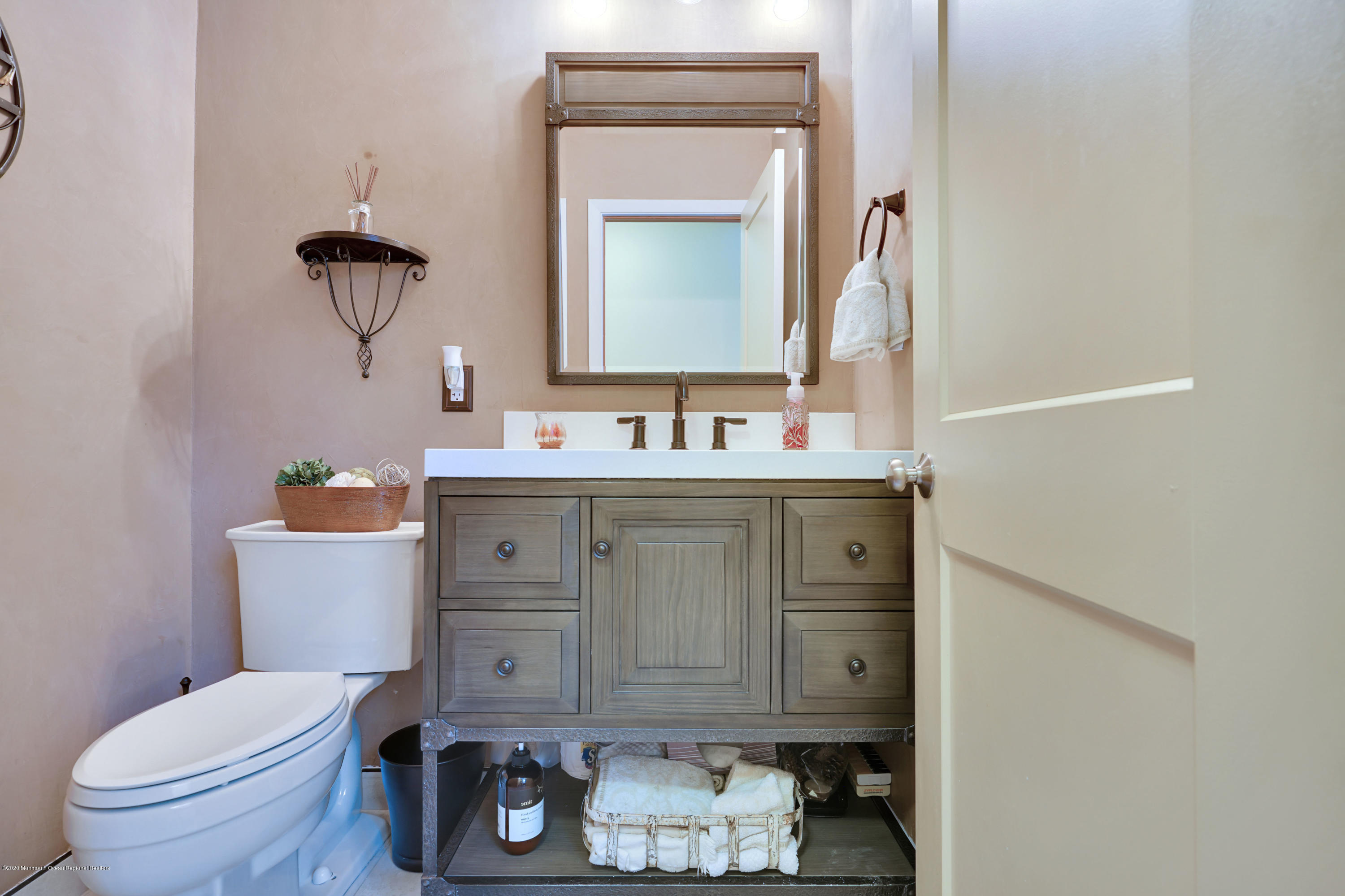 12 Crest Drive Colts Neck, NJ 07722 - Photo 46 of 69 a bathroom with a toilet sink and mirror