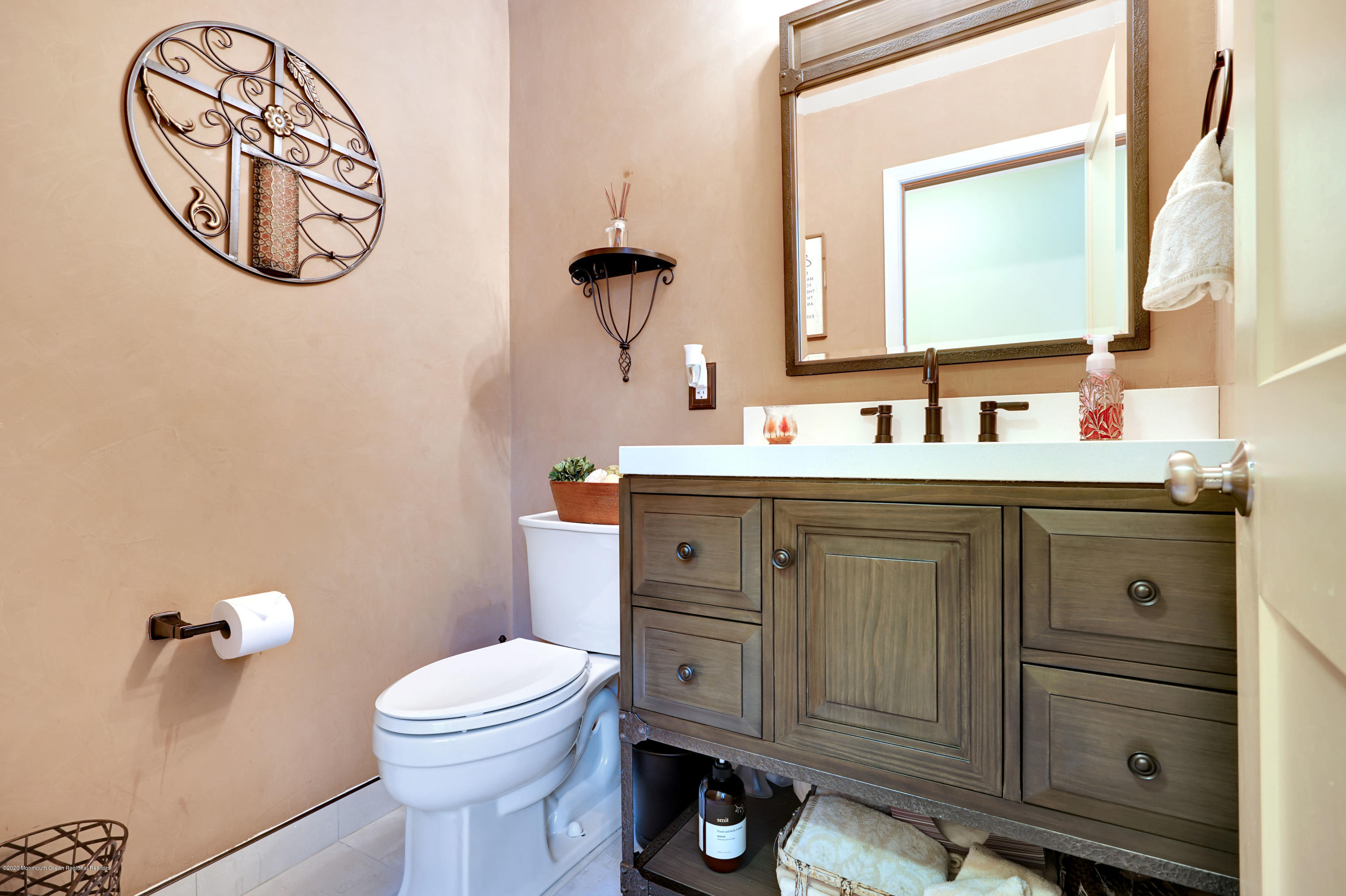 12 Crest Drive Colts Neck, NJ 07722 - Photo 47 of 69 a bathroom with a toilet a sink and a mirror