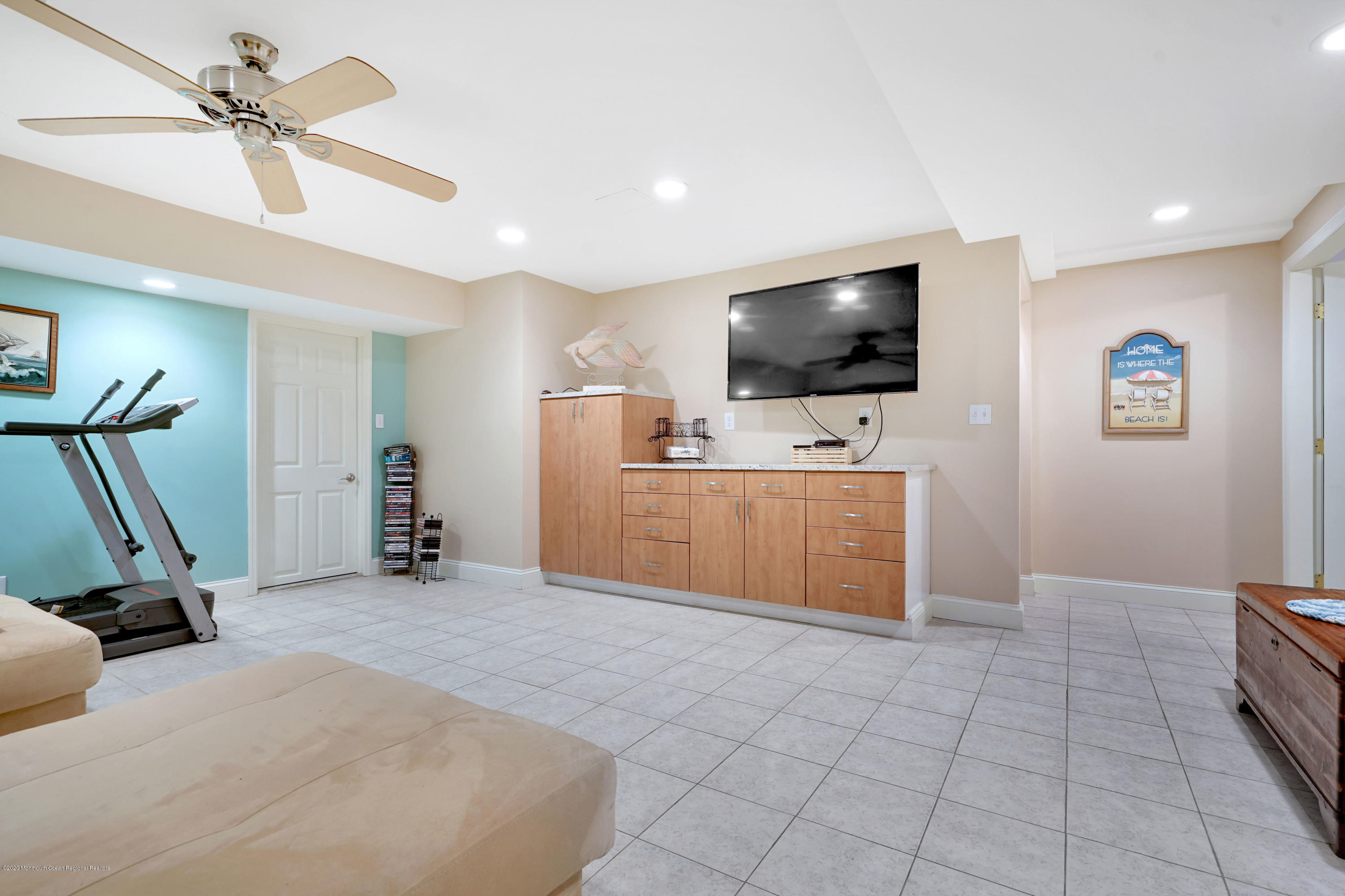 12 Crest Drive Colts Neck, NJ 07722 - Photo 49 of 69 a view of a livingroom with furniture and a flat screen tv