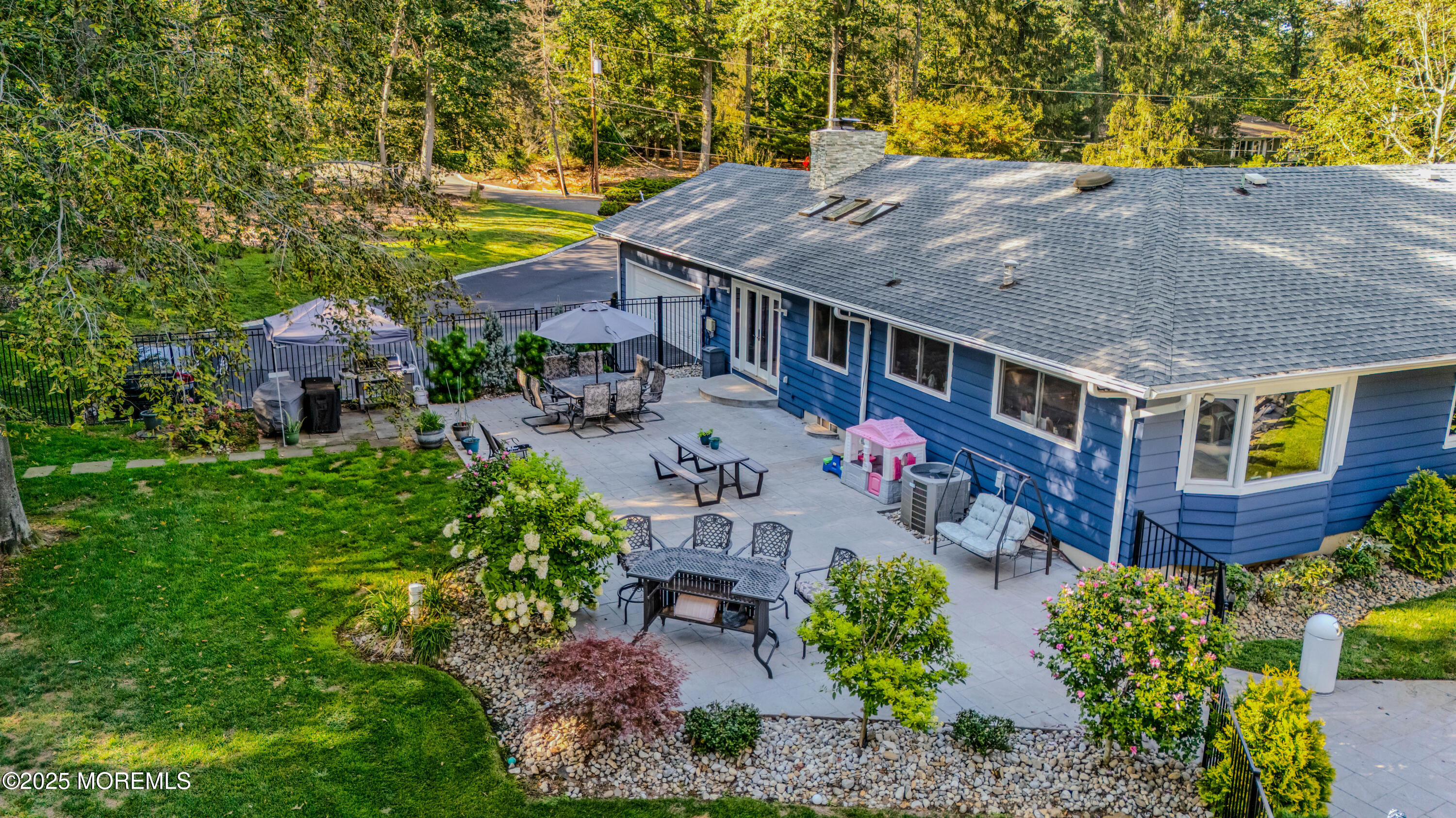 12 Crest Drive Colts Neck, NJ 07722 - Photo 56 of 69 an aerial view of a house with swimming pool and large trees