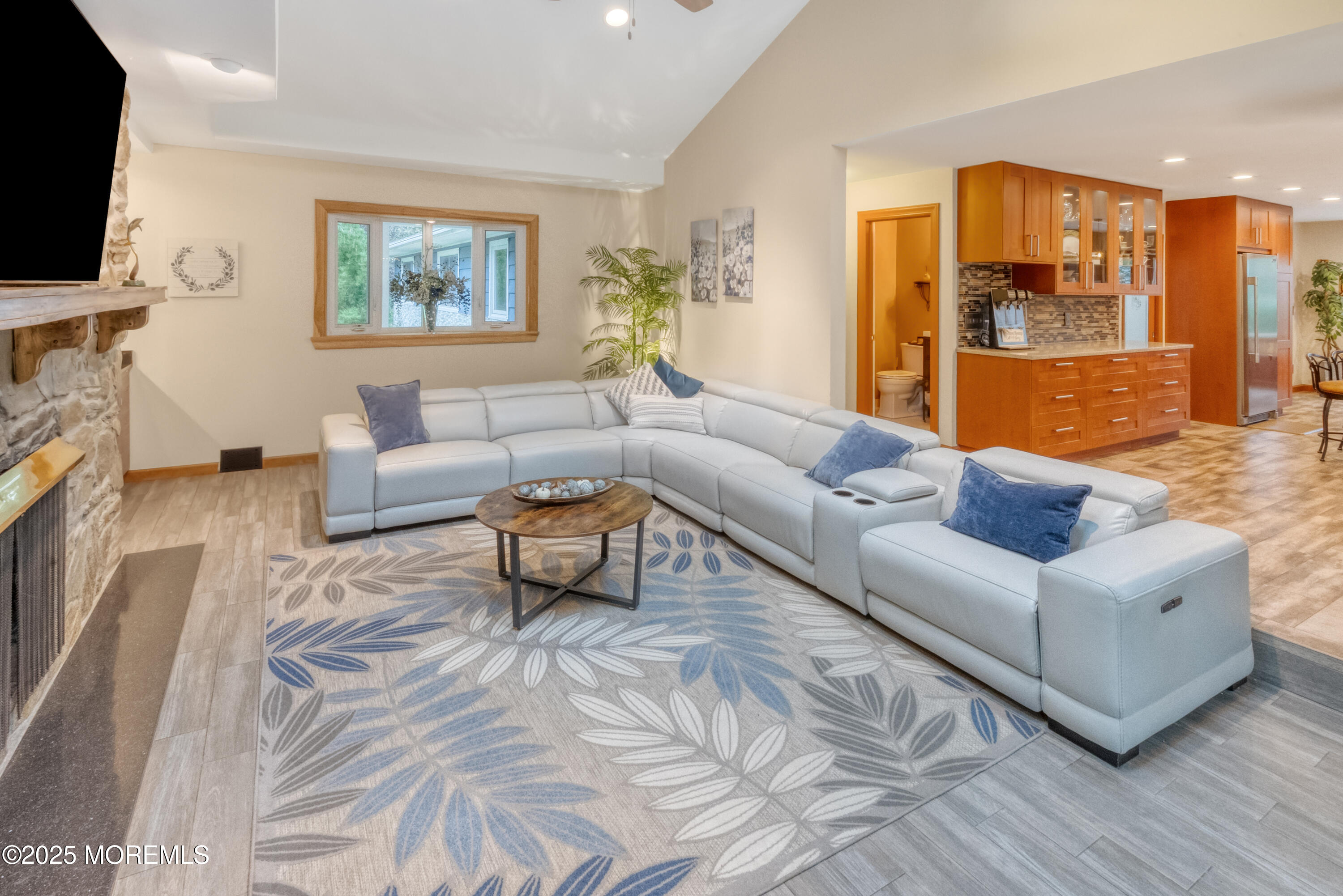 12 Crest Drive Colts Neck, NJ 07722 - Photo 8 of 69 a living room with furniture and a flat screen tv
