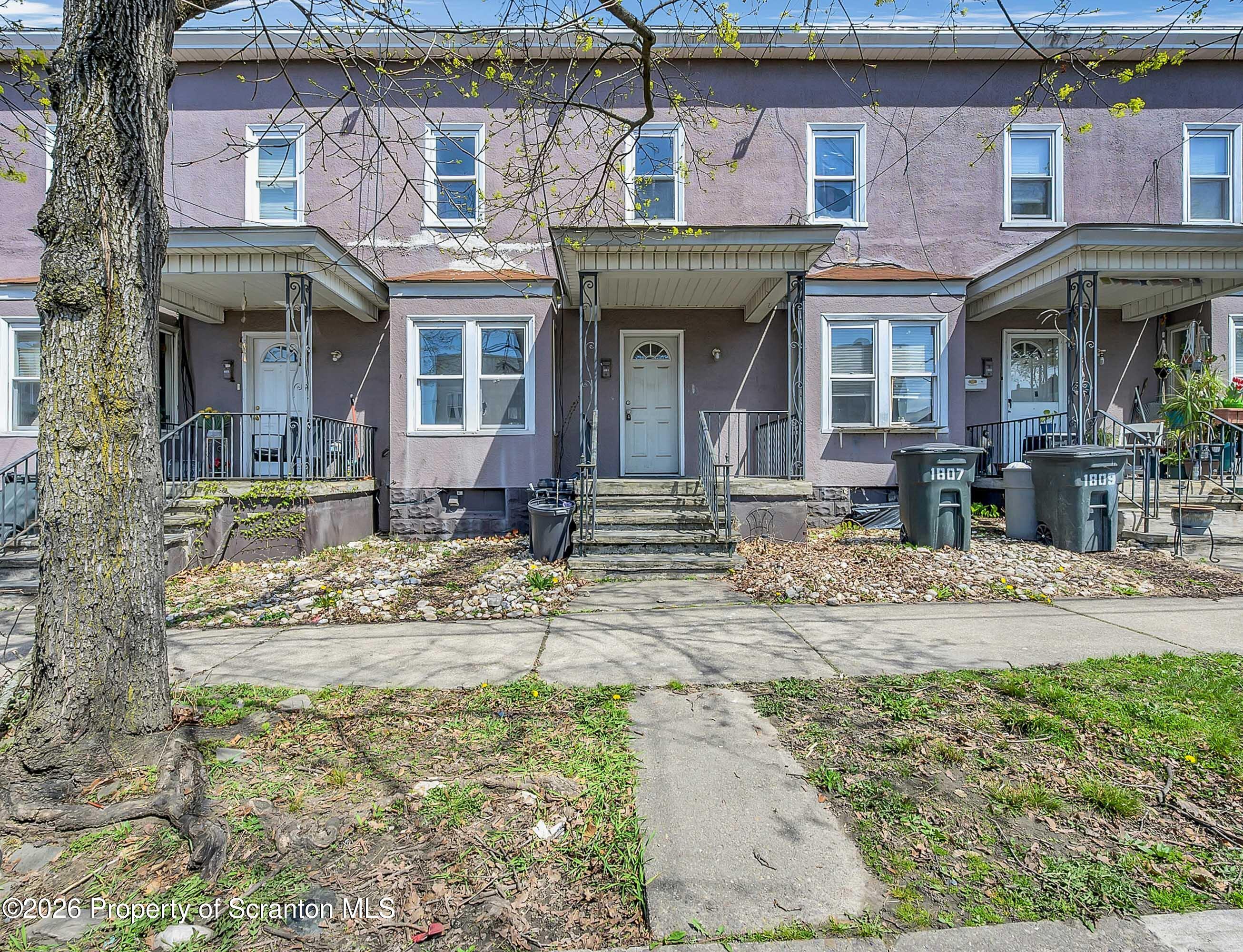 1807 Green Ridge Street Dunmore, PA 18509 - Photo 12 of 14 front view of a brick house with a small yard
