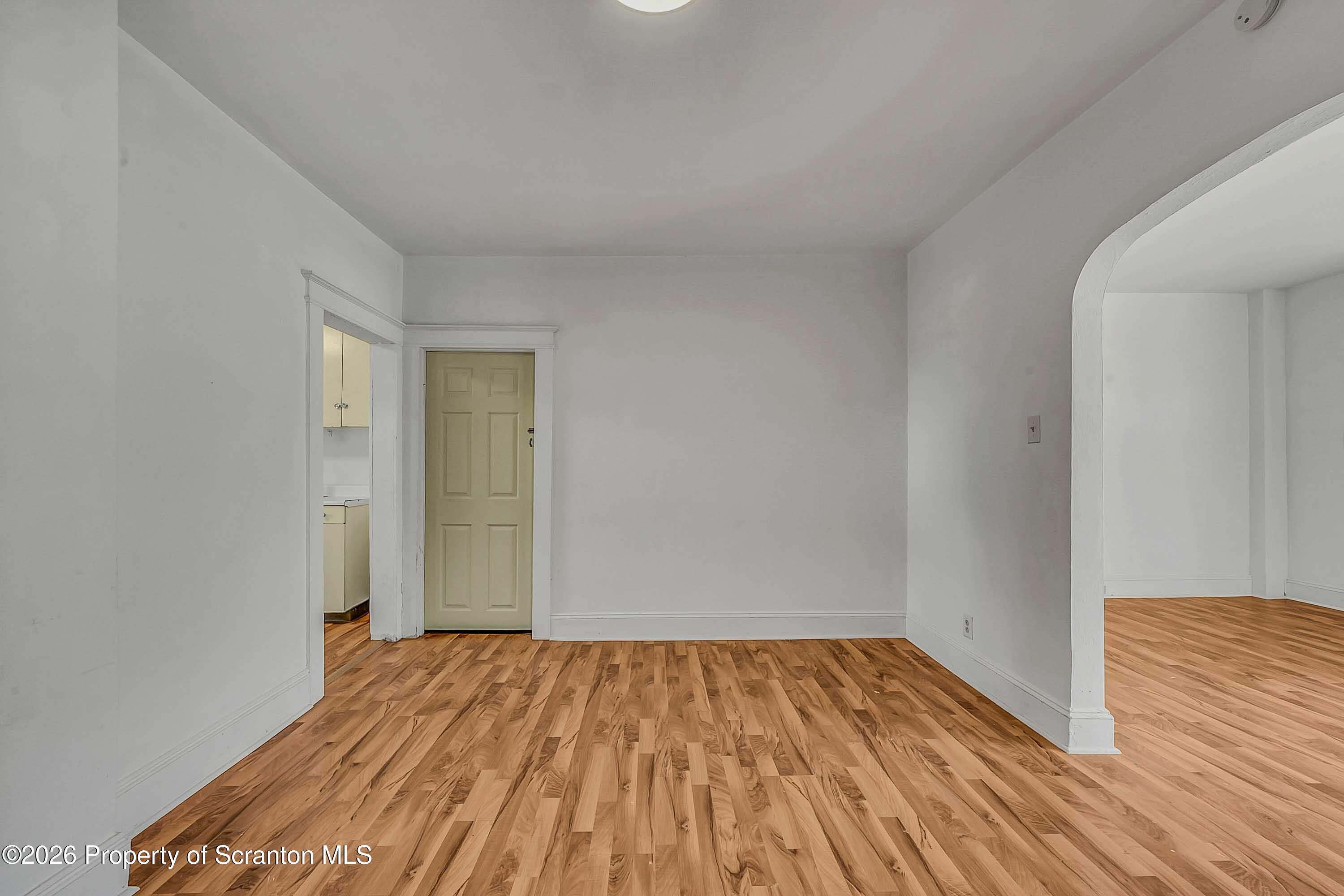 1807 Green Ridge Street Dunmore, PA 18509 - Photo 4 of 14 a view of empty room with wooden floor
