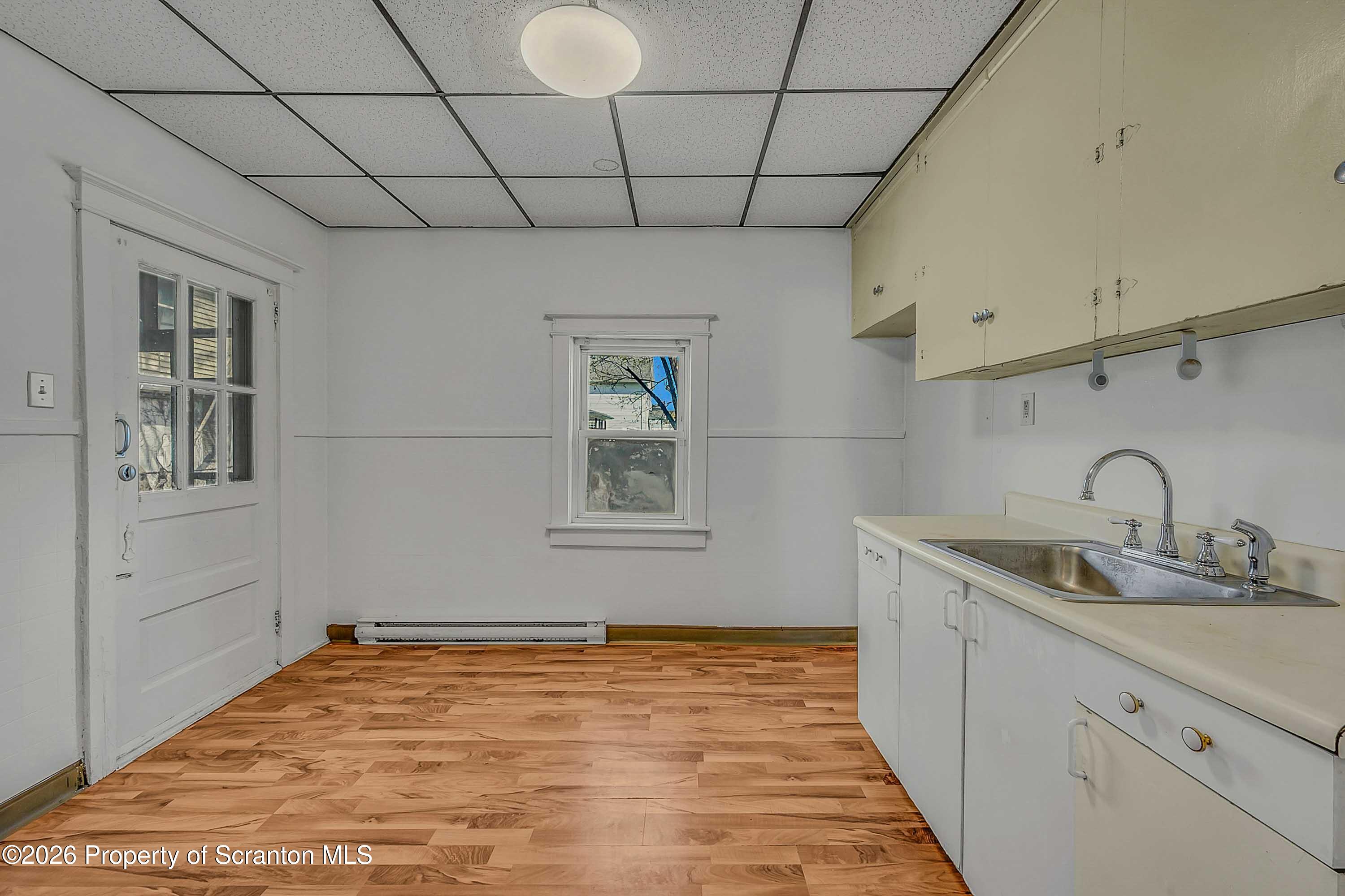 1807 Green Ridge Street Dunmore, PA 18509 - Photo 5 of 14 a kitchen with stainless steel appliances granite countertop a sink stove and cabinets
