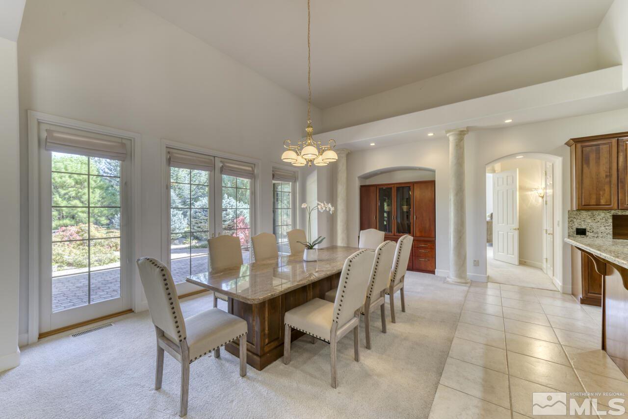 4565 Mountaingate Drive Reno, NV 89519 - Photo 11 of 25 a view of a dining room with furniture window and outside view