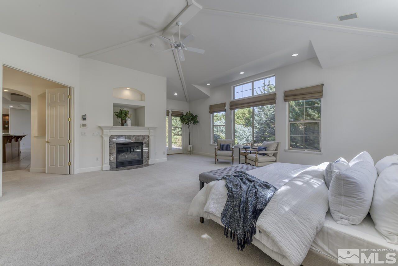 4565 Mountaingate Drive Reno, NV 89519 - Photo 13 of 25 a bed room with a bed and a fireplace