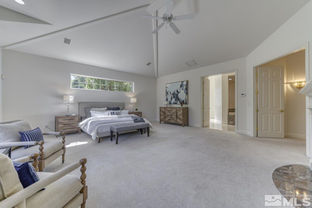 4565 Mountaingate Drive Reno, NV 89519 - Photo 15 of 25 a bedroom with furniture and a chandelier