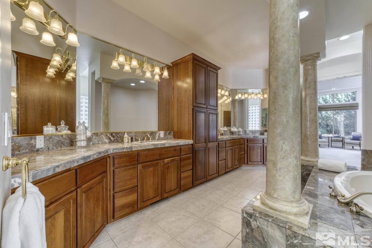 4565 Mountaingate Drive Reno, NV 89519 - Photo 18 of 25 a large bathroom with a large tub and sink