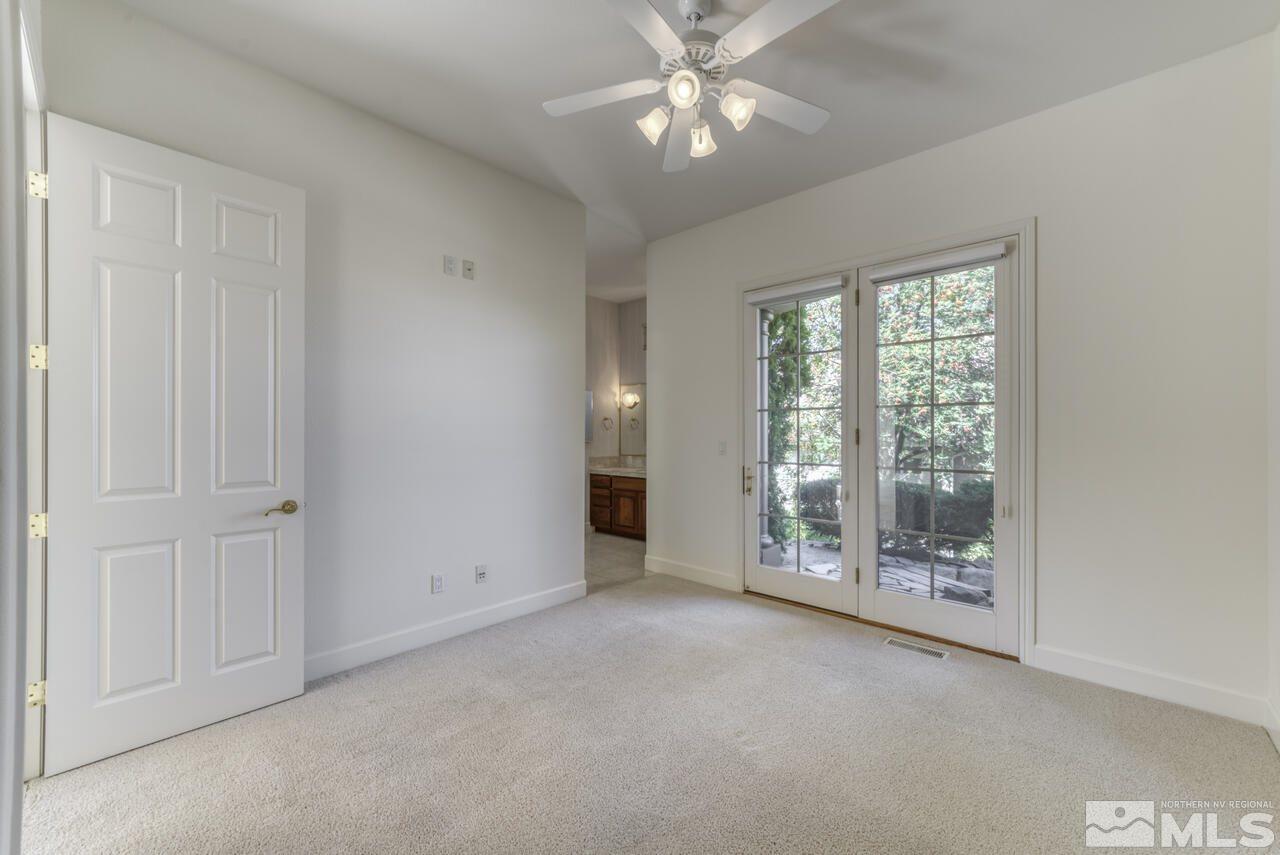 4565 Mountaingate Drive Reno, NV 89519 - Photo 20 of 25 a view of an empty room with chandelier fan