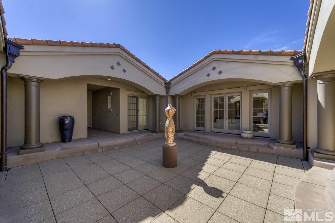 4565 Mountaingate Drive Reno, NV 89519 - Photo 21 of 25 a view of a building with entryway and a yard