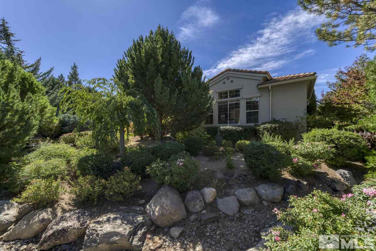 4565 Mountaingate Drive Reno, NV 89519 - Photo 22 of 25 a front view of a house with a yard