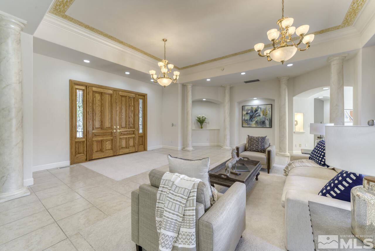 4565 Mountaingate Drive Reno, NV 89519 - Photo 3 of 25 a living room with furniture chandelier and a dining table