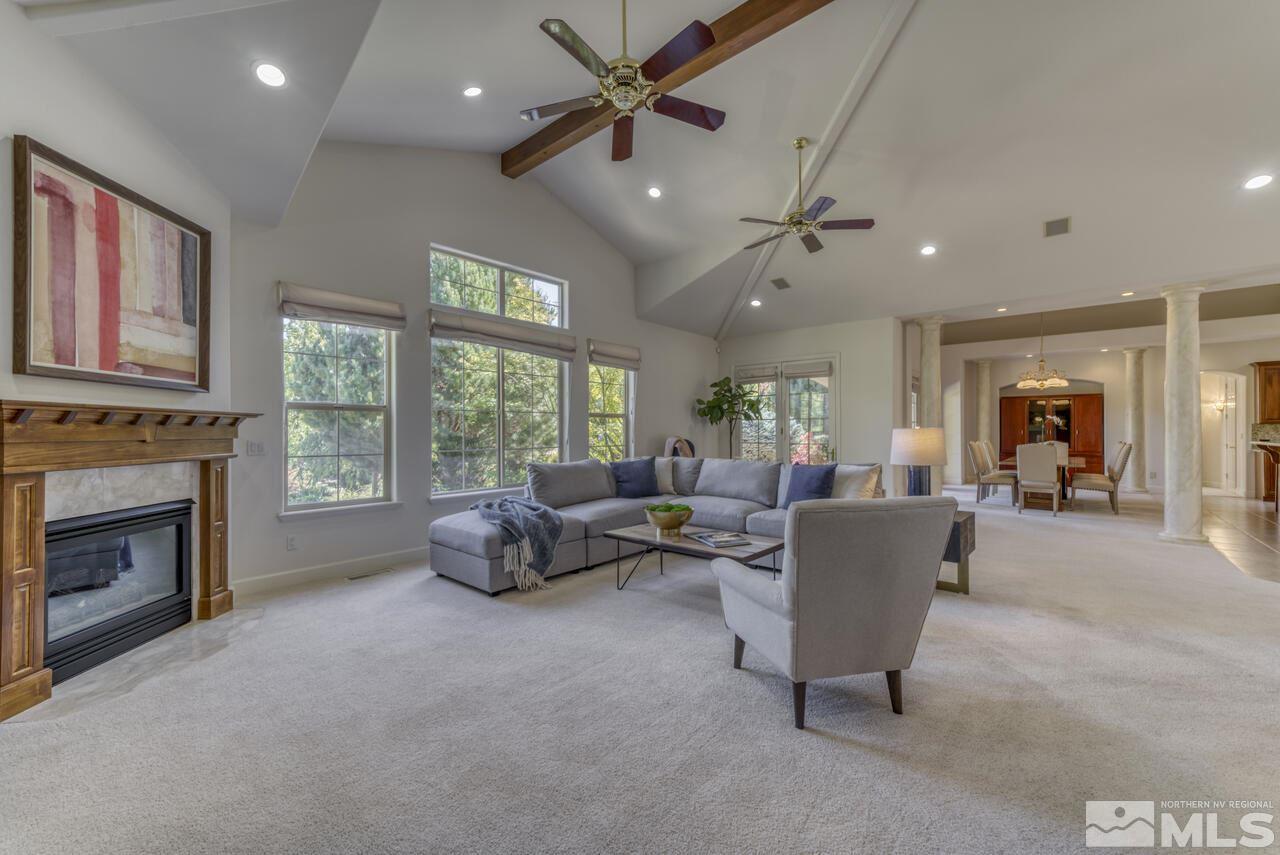 4565 Mountaingate Drive Reno, NV 89519 - Photo 5 of 25 a living room with furniture and a fireplace