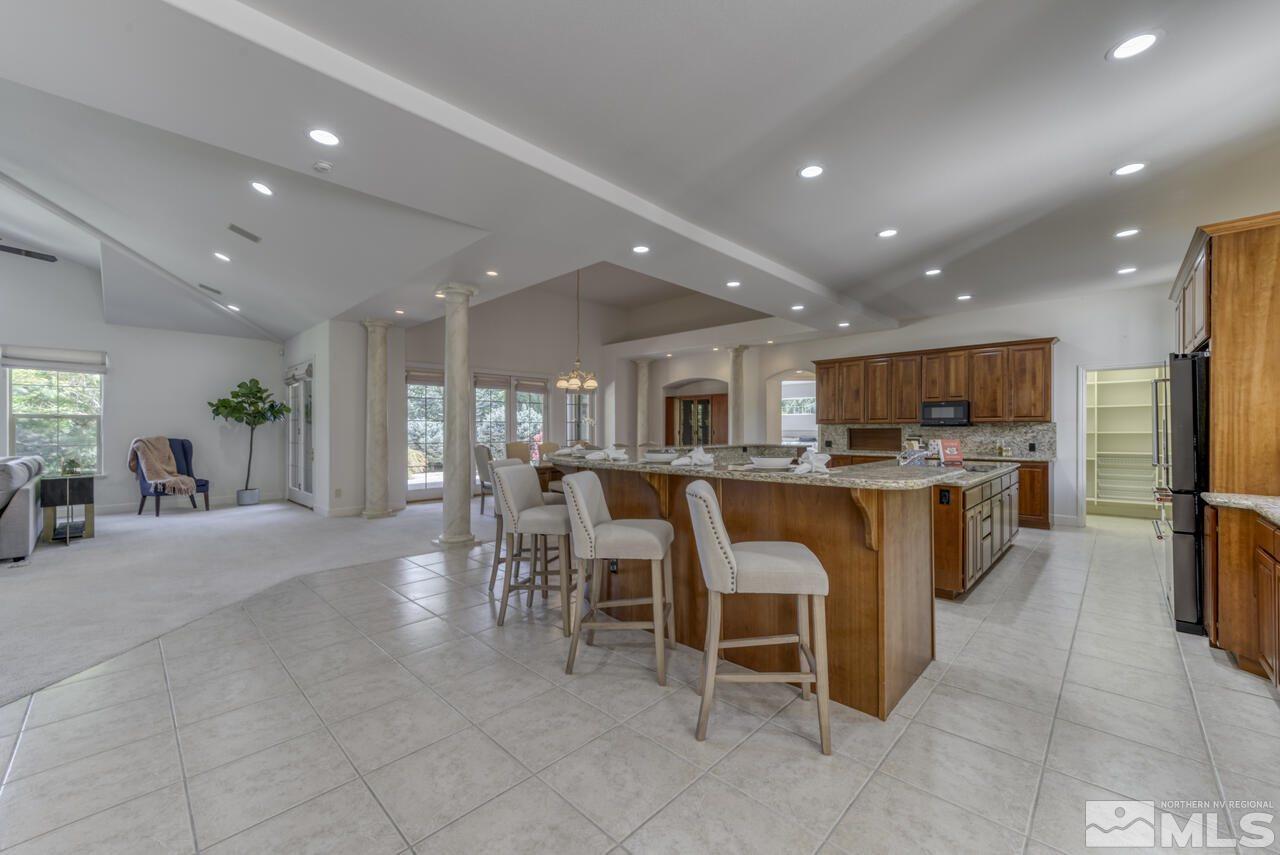 4565 Mountaingate Drive Reno, NV 89519 - Photo 7 of 25 a large kitchen with a table and chairs in it