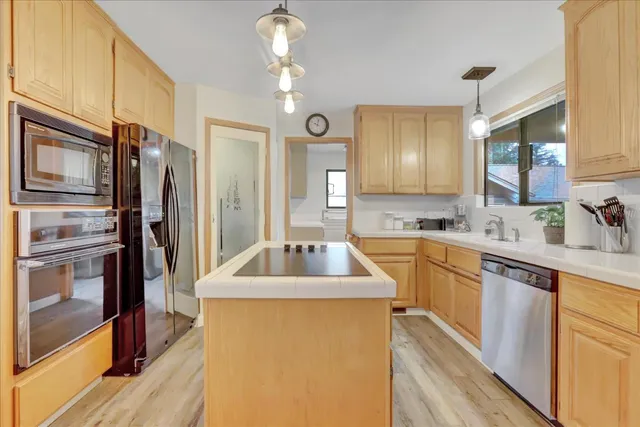 a bedroom with furniture and a flat screen tv
