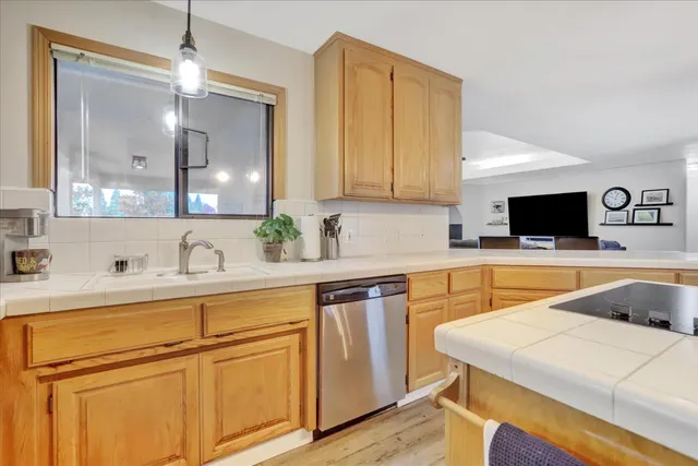 a spacious bathroom with a double vanity sink and a mirror