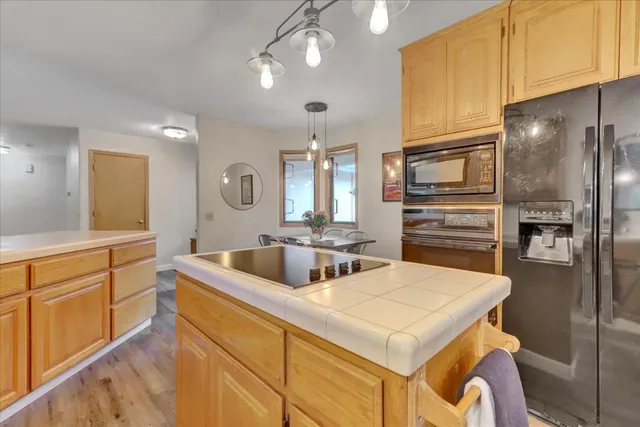 a bedroom with a bed and a table in it