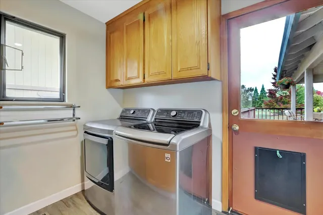 a bathroom with a granite countertop sink mirror and toilet