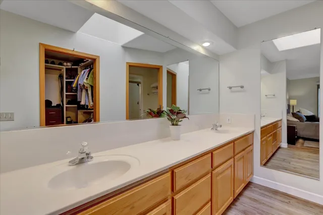 a view of a house with a yard and sitting area