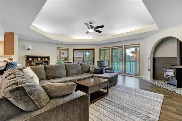 a living room with furniture and a wooden floor