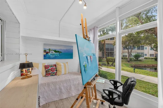 a view of a livingroom with furniture and garden view