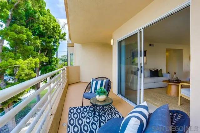 a kitchen with stainless steel appliances granite countertop a sink refrigerator and cabinets