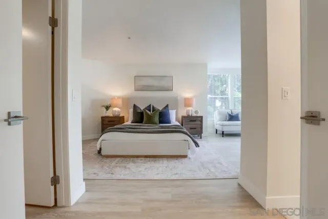 a white toilet sitting next to a bath tub and shower