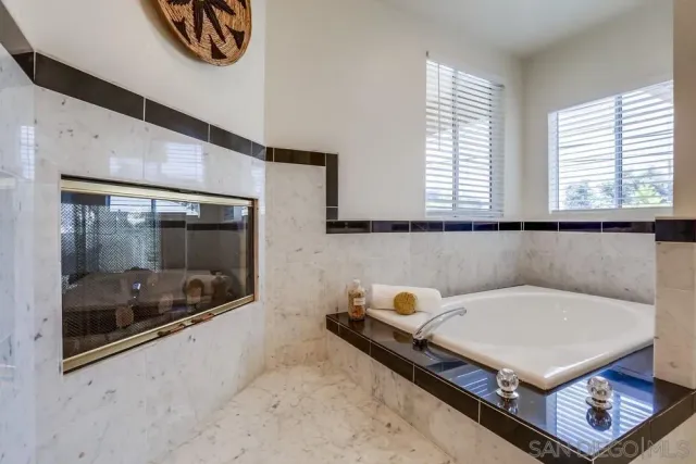 a view of a building with a garden and plants