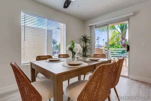 a view of a dining room with furniture window and outside view