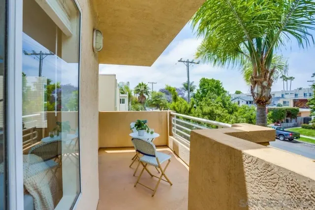 a view of balcony with furniture