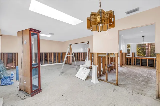 a view of livingroom with furniture and white floor