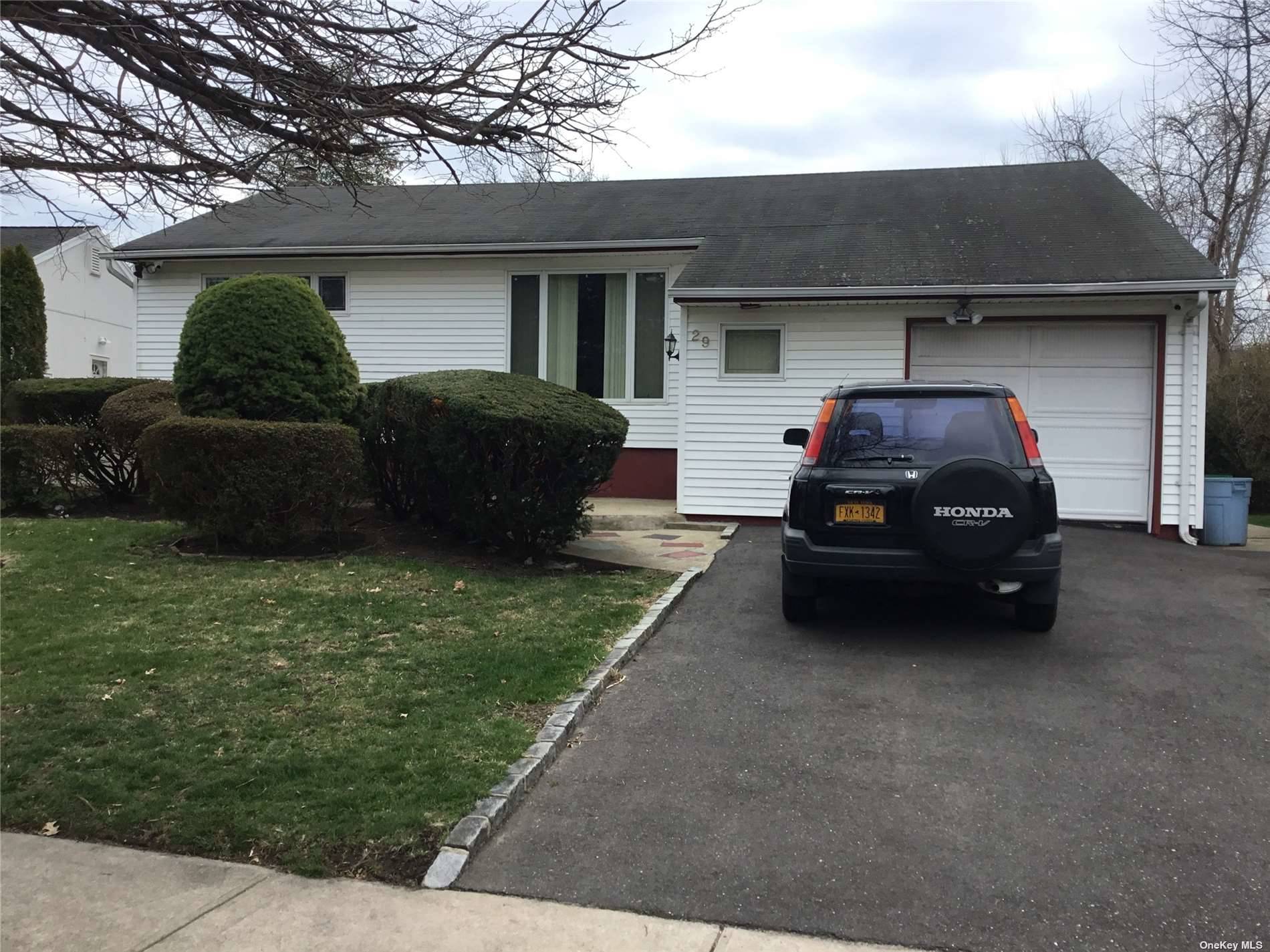 29 Forest Road Valley Stream, NY 11581 - Photo 1 of 1 a house view with a garden space