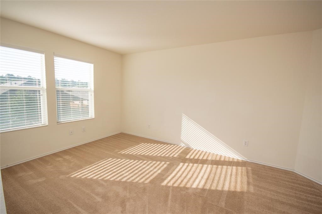 310 Falling Pine Drive Conroe, TX 77304 - Photo 12 of 15 a view of an empty room and window