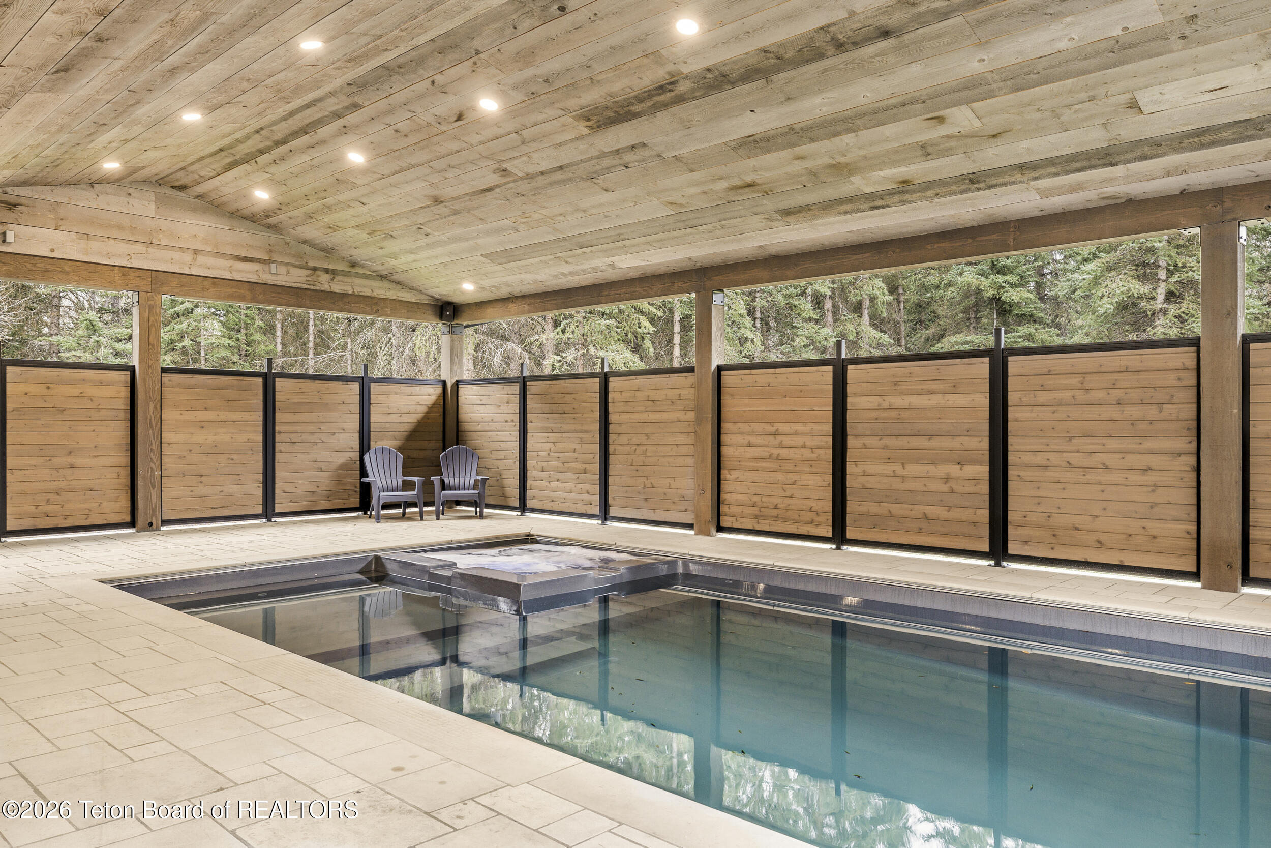 8910 Porter Loop Road Jackson, WY 83001 - Photo 52 of 85 Covered heated salt water pool