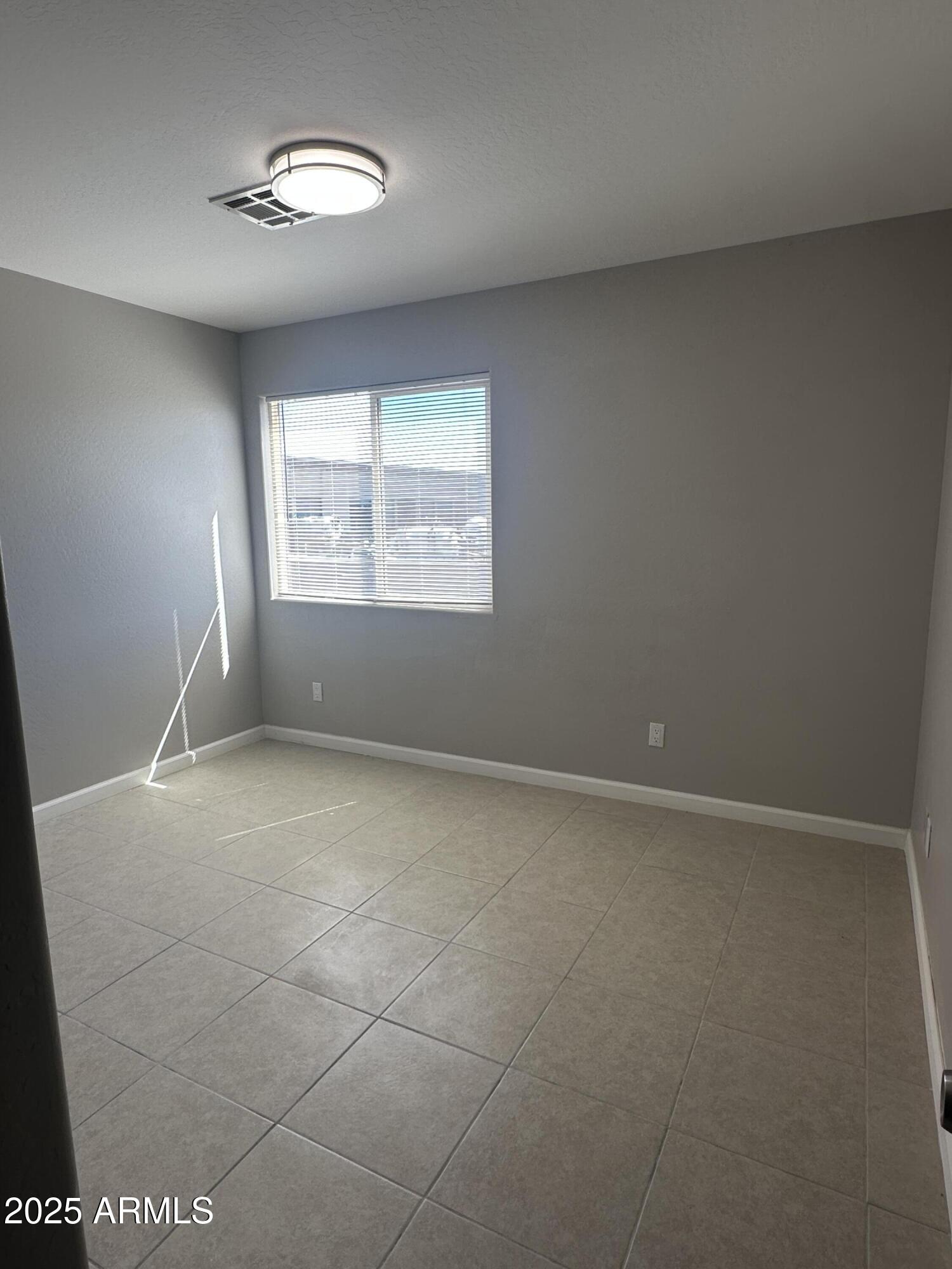 1714 South 5th Street Phoenix, AZ 85004 - Photo 13 of 21 an empty room with a empty space and windows
