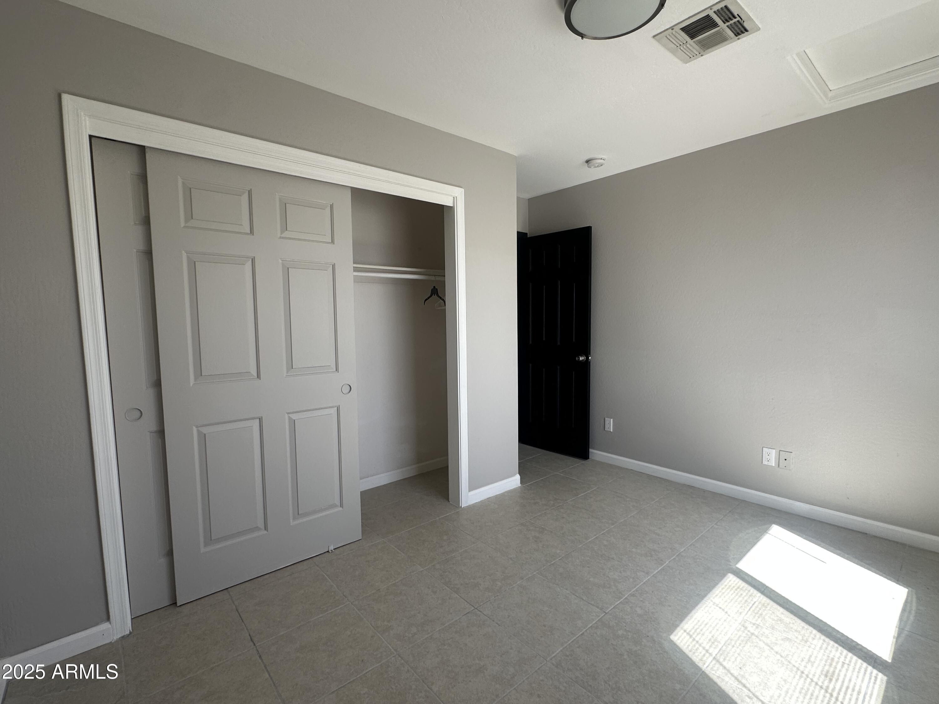1714 South 5th Street Phoenix, AZ 85004 - Photo 15 of 21 an empty room with ceiling fan
