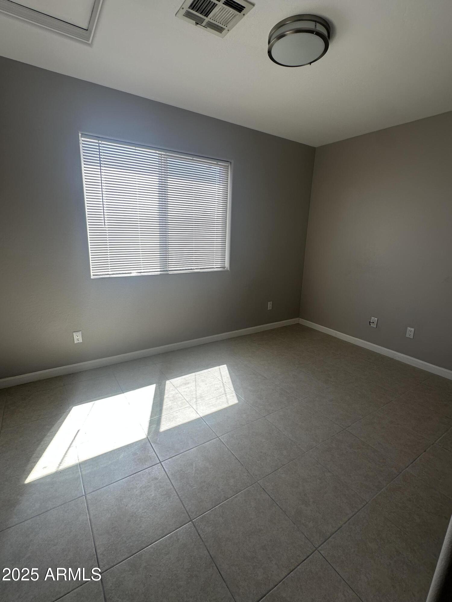 1714 South 5th Street Phoenix, AZ 85004 - Photo 16 of 21 an empty room with a window
