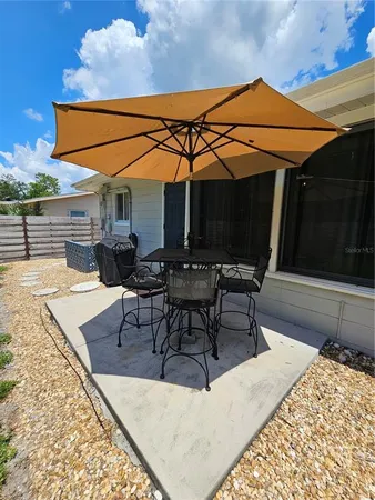 a outdoor space with the couches and dining table