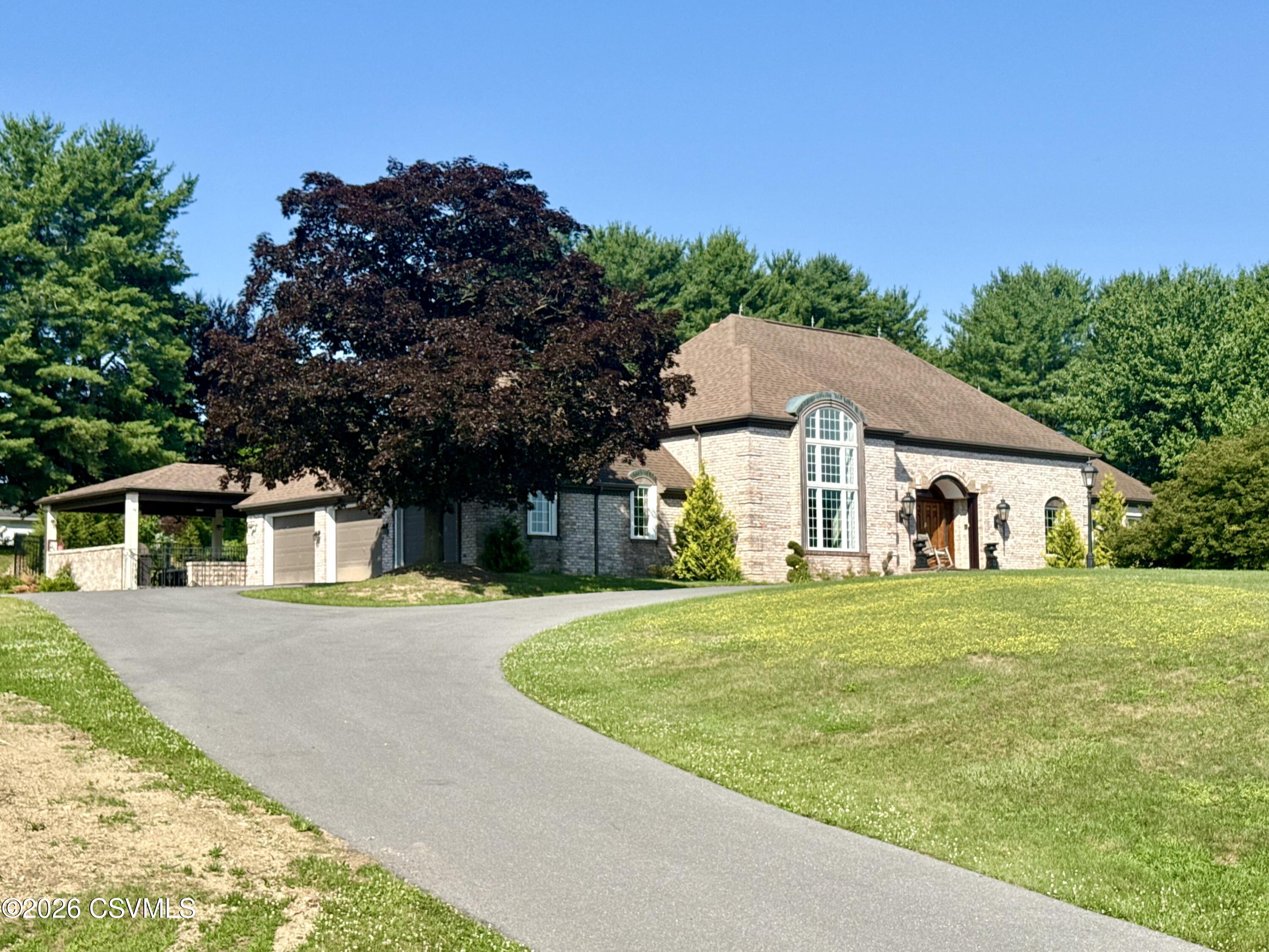 50 Sweet Gum Road Selinsgrove, PA 17870 - Photo 2 of 82 a front view of a house with a yard and trees