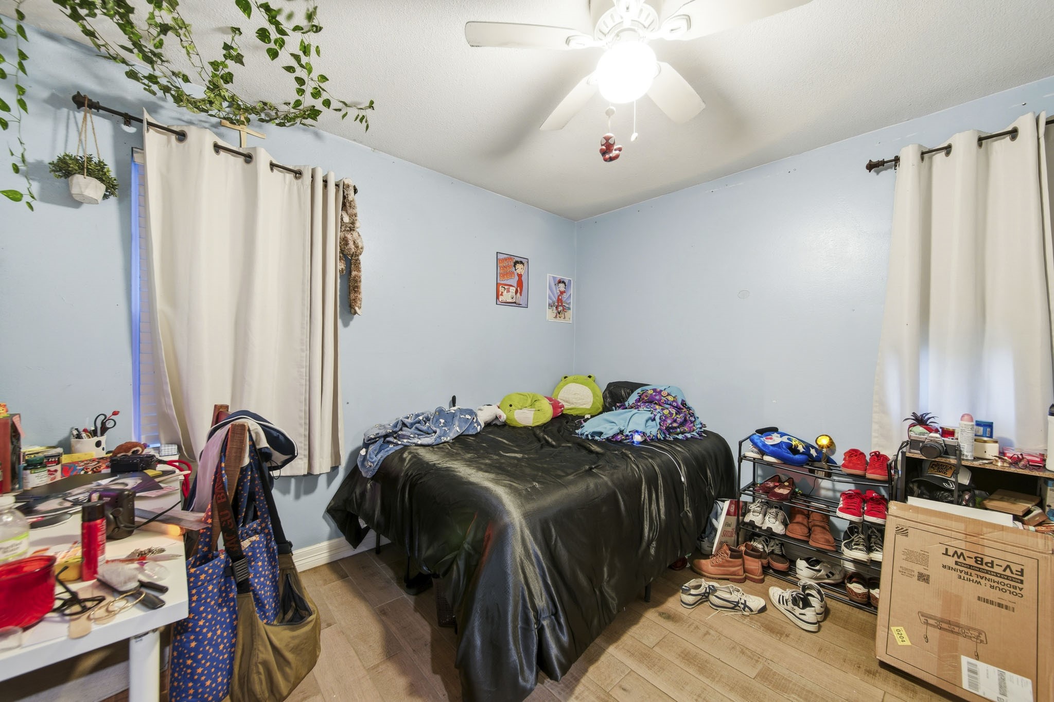 731 Meneley Road Winnie, TX 77665 - Photo 18 of 27 a bedroom with a bed and a chandelier