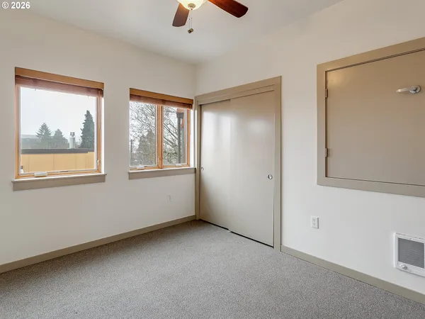 a bathroom with a granite countertop sink toilet a shower and a mirror