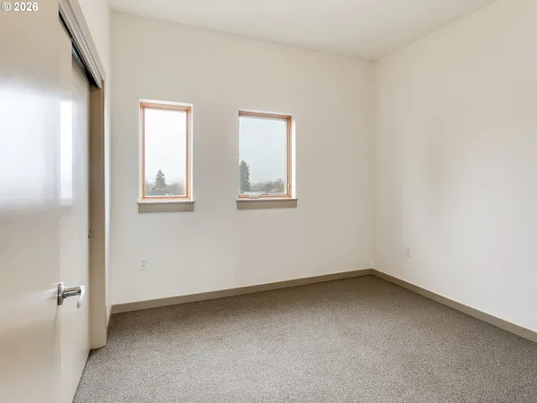a view of room with window and closet