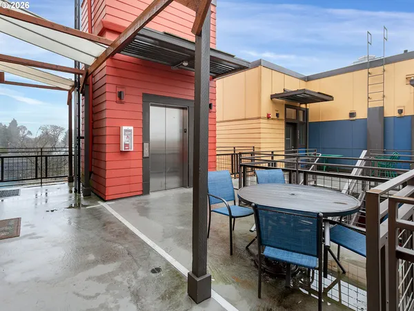 a view of a chairs and table in the patio