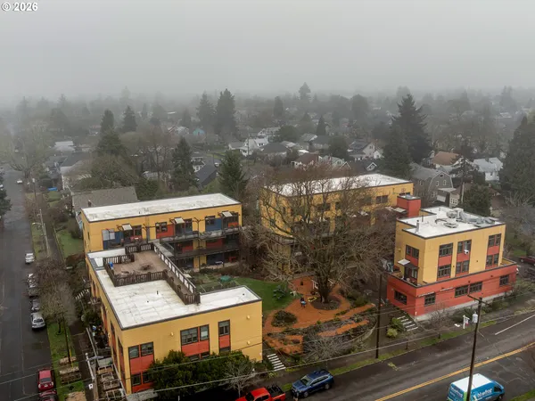 a view of street with an entrance and a cafe