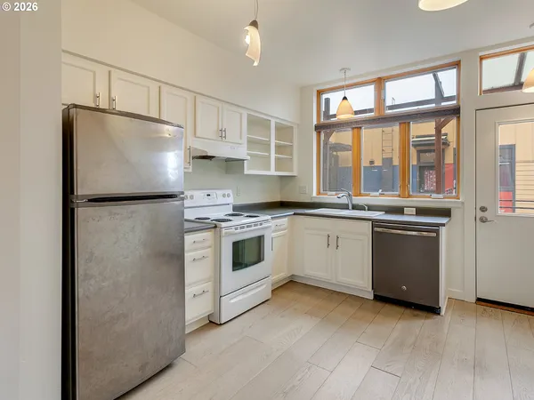 a kitchen with a sink and large window