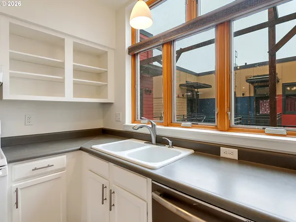 a white stove top oven sitting inside of a kitchen