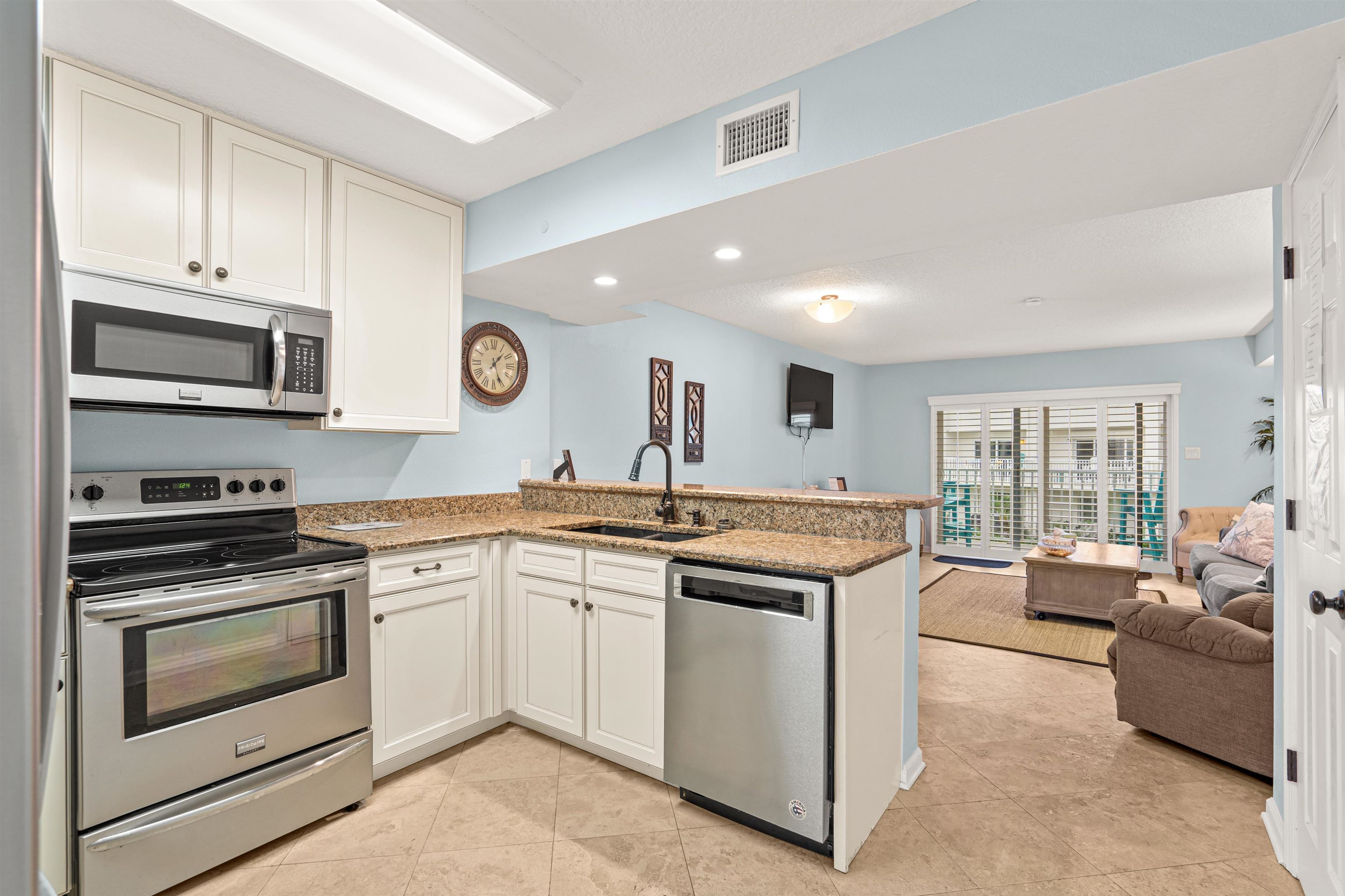 1 Ocean Trace Road, Unit 232 St. Augustine, FL 32080 - Photo 3 of 49 a open kitchen with stainless steel appliances granite countertop a stove and cabinets