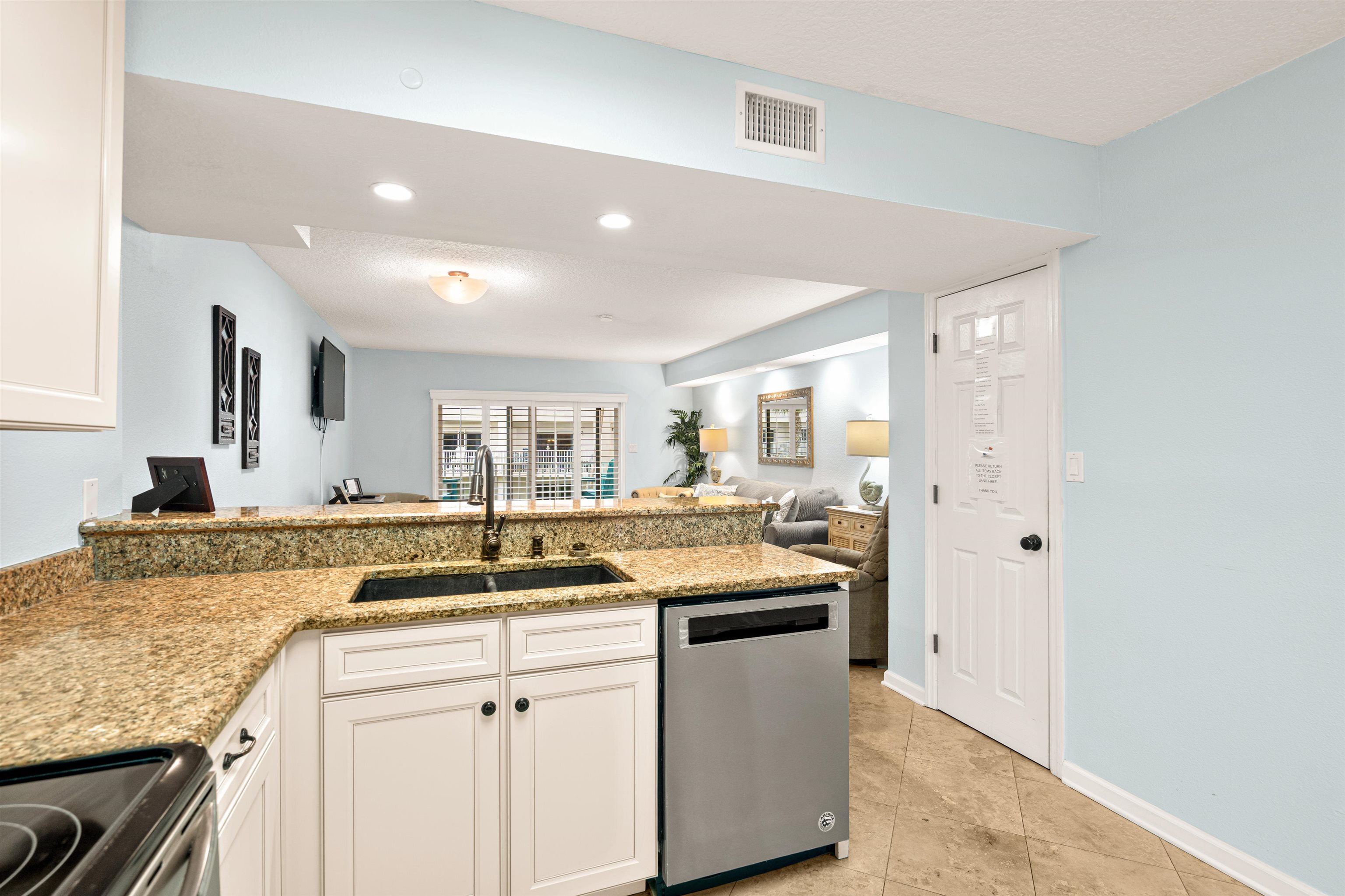 1 Ocean Trace Road, Unit 232 St. Augustine, FL 32080 - Photo 5 of 49 a kitchen with a sink stove and cabinets